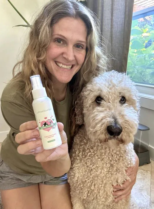 Customer holding DentaClean with her doodle